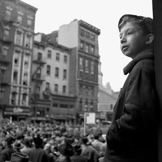 Boy over the crowd in New York