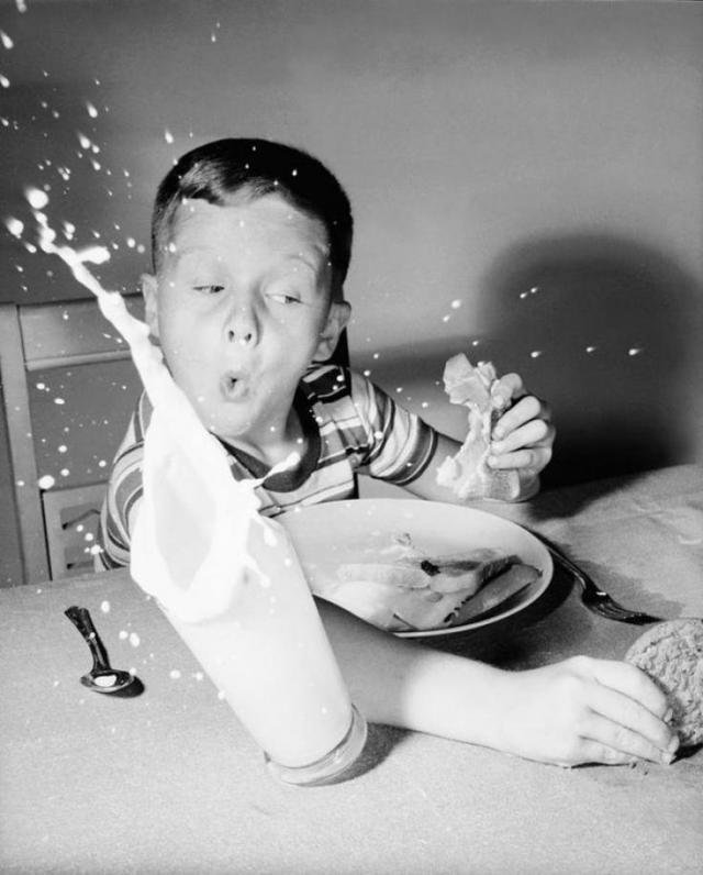 Child reversing his glass of milk