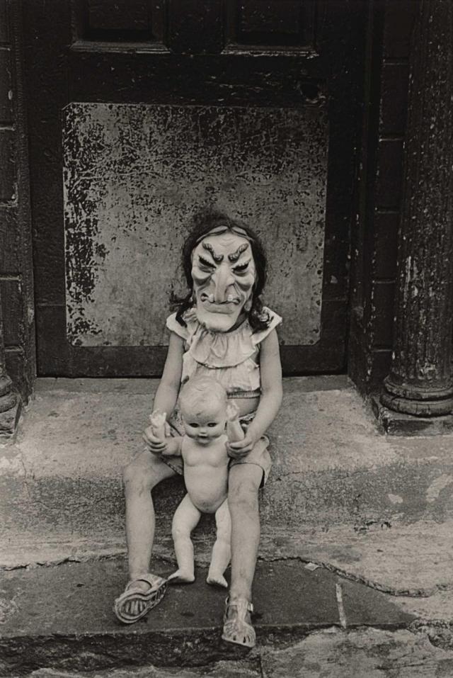 Masked Child with a Doll
